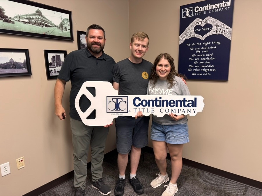Noah and Anna on closing day, Shawnee, KS, with Luke Wright