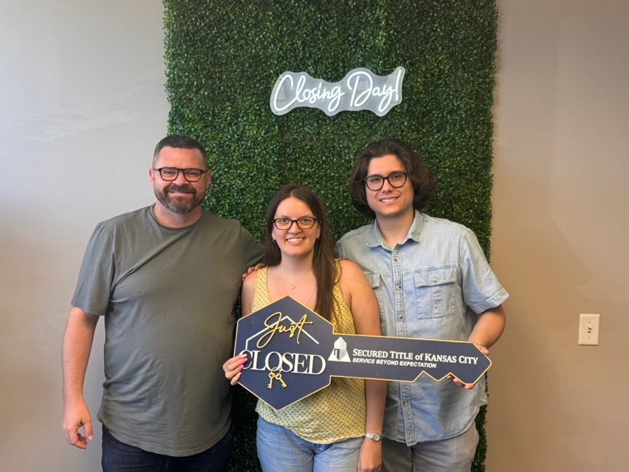 Beth and James on closing day, Kansas City, MO, with Luke Wright