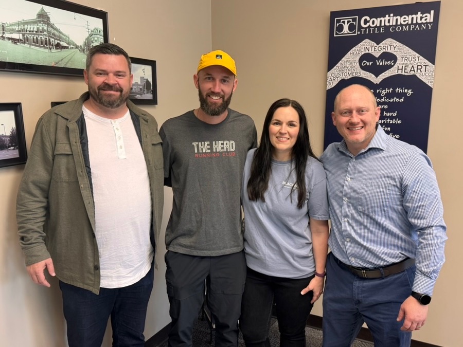 Greg and Kylea on closing day, Lenexa, KS, with Luke Wright and lender Tim Munyan