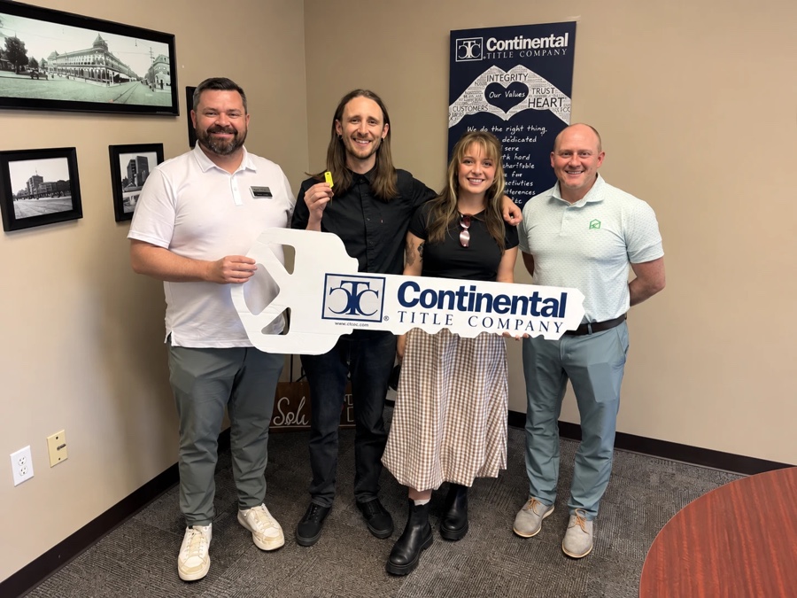 Jordan and Tori on closing day, Kansas City, MO, with Luke Wright and lender Tim Munyan