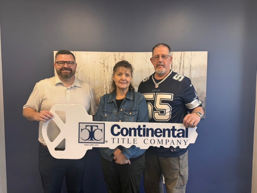 John and Cindy on closing day, Lone Jack, MO, with Luke Wright